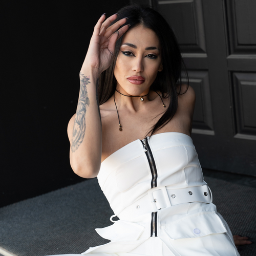 woman wearing a white strapless top