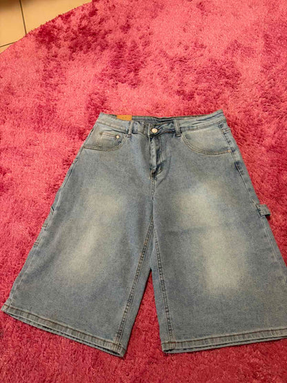 Front view of light-wash utility denim Bermuda shorts